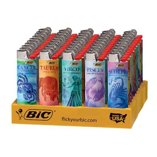 Bic Astrology lighters in a variety of designs in a display tray.