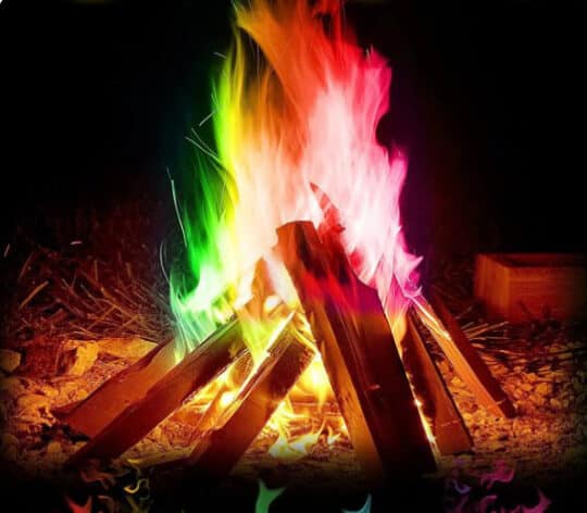 Color flames in a campfire from packet of Magic Fire Flames