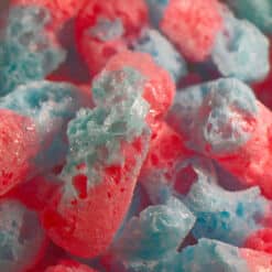 Sweet Worms Freeze Dried candy closeup of candy pieces are shown.