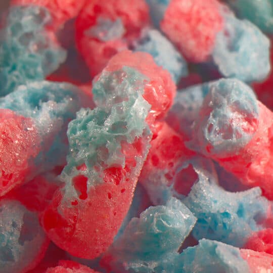 Sweet Worms Freeze Dried candy closeup of candy pieces are shown.