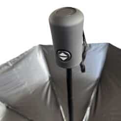 Polyester umbrella showing partial inside view, opened with silver UV protector and handle grip with open-close button.