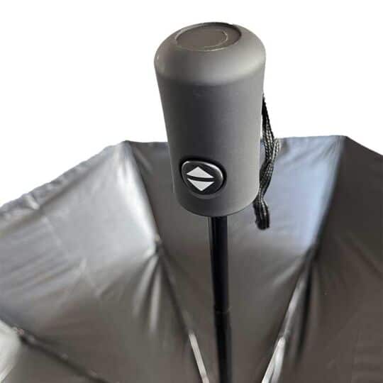 Polyester umbrella showing partial inside view, opened with silver UV protector and handle grip with open-close button.