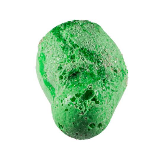 Green piece of Taffy Bombs Freeze Dried Candy closeup can see texture.