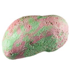 Pink and green piece of Taffy Bombs Freeze Dried Candy closeup can see texture.